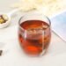 clear glass cup with brown liquid
