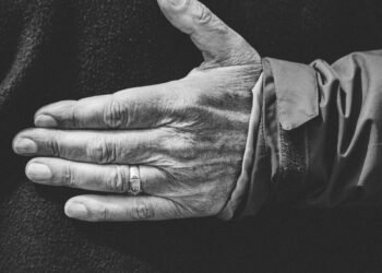 close-up photo of person wearing wedding ring