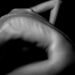 La symbolique du mal de dos : comprendre ses causes et solutions profondes 9 a naked woman sitting on a table with her back to the camera