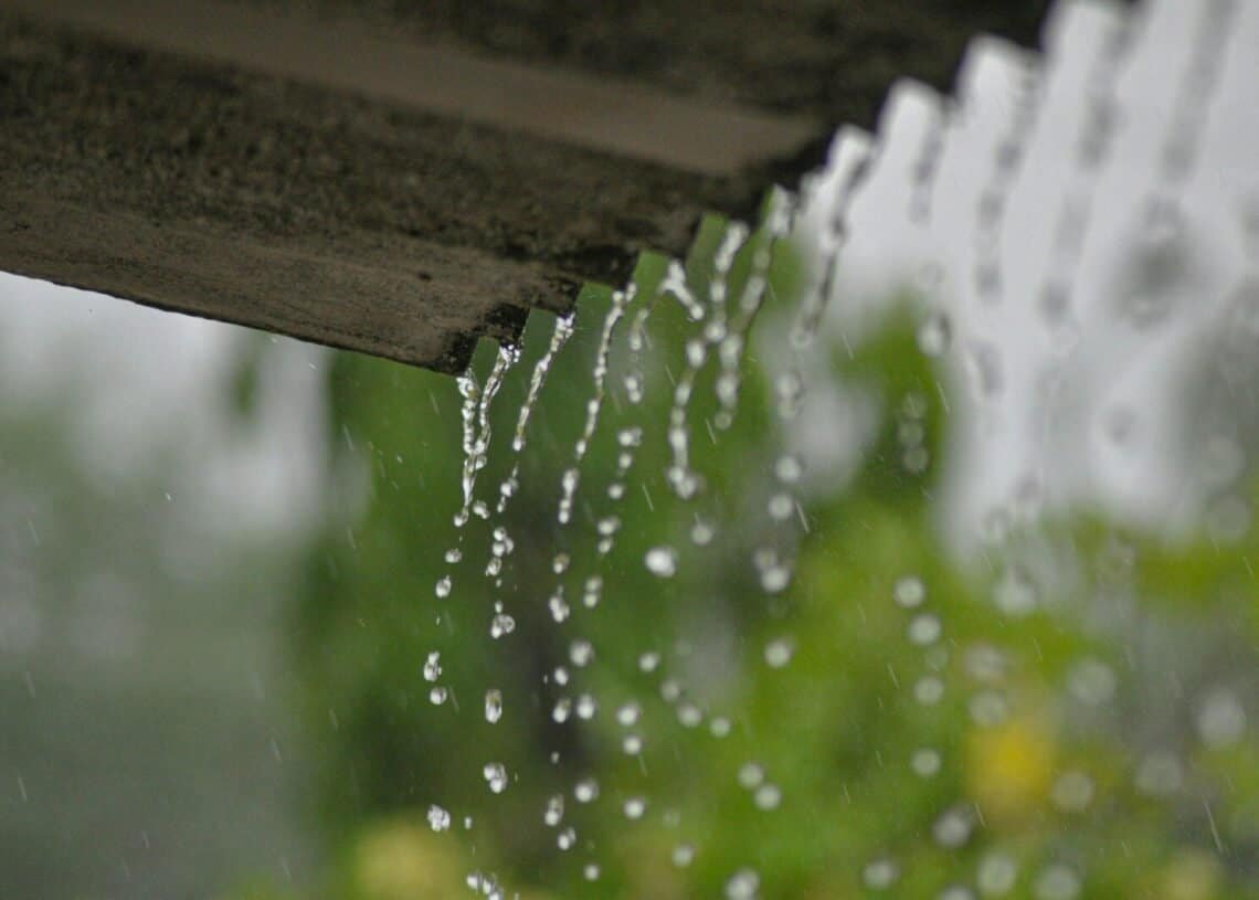a rain gutter with water running down it