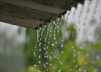 a rain gutter with water running down it