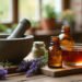 Santé naturelle : le guide complet des soins et remèdes pour toute la famille 7 Mortier, flacons d'huiles essentielles, lavande et infusion sur une table en bois : santé naturelle